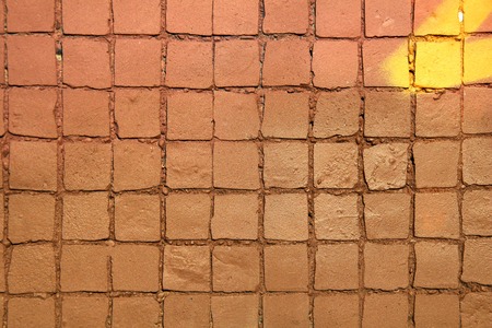 Painted mosaic brick tile wall, close up of graffiti texture, with vibrant colors for creativity, imaginative backgrounds and ideas.の写真素材