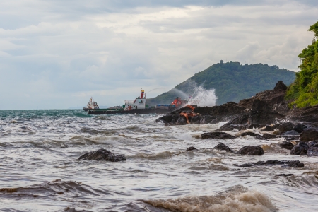 RAYONG,THAILAND-July 31   Thailand government use the boat spray the chemical to sink the crude oil on oil spill accident on Ao Prao Beach at Samet island on July 31,2013 in Rayong,Thailand のeditorial素材