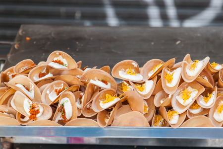 Thai crispy pancake - cream crepes and gold egg yolks in Thailand street market