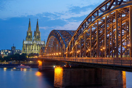 Cologne Cathedral and Hohenzollern Bridge at sunsetの写真素材