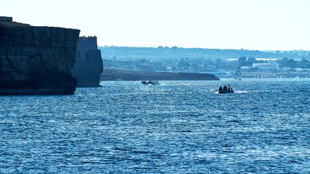 Scenic view of Boats sailing Polignano a Mare Coastのeditorial素材