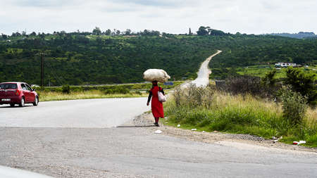 Women carries bag over her head