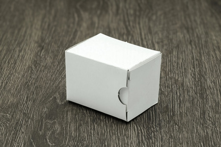 Blank white box mock up on wood backgroundの写真素材