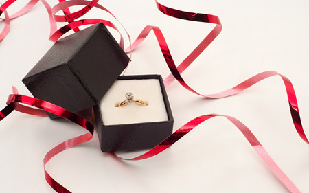 Valentine day background with ring and ribbonsの写真素材