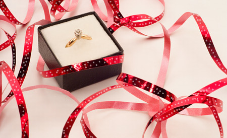 Valentine day background with ring and ribbonsの写真素材