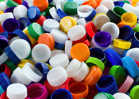 Group of assorted colored plastic cups for recyclingの写真素材