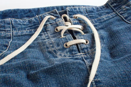 Jeans skirt with lacing on white backgroundの写真素材