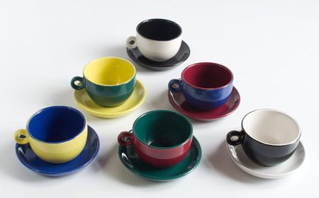 Set of varicolored small cups with saucersの写真素材
