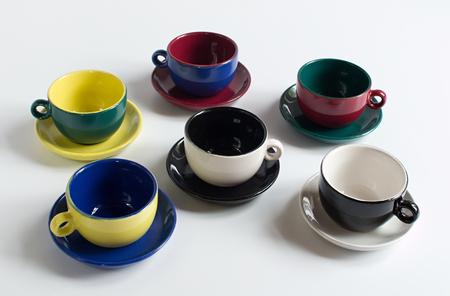 Set of varicolored small cups with saucersの写真素材
