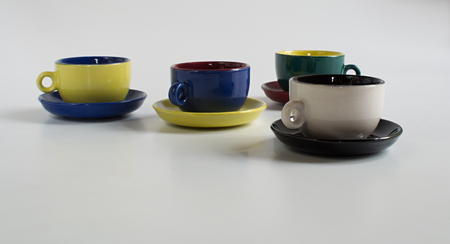 Set of varicolored small cups with saucersの写真素材
