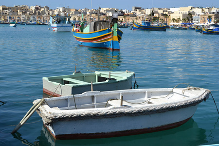 Fishing boats and luzzu boats in Marsaxlokk, Maltaの写真素材