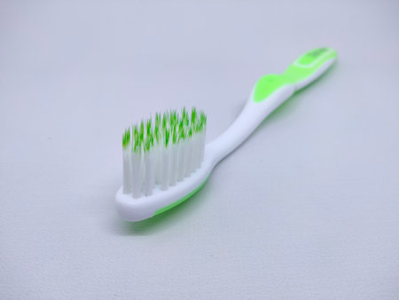 Toothbrush with white and green color.の写真素材