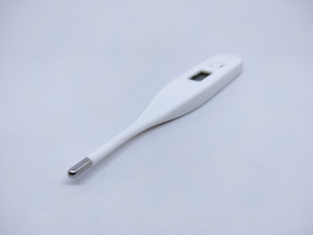 Electronic body thermometer displaying healthy human body temperature. isolated on white.