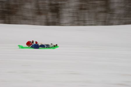 boy is sleddingの写真素材