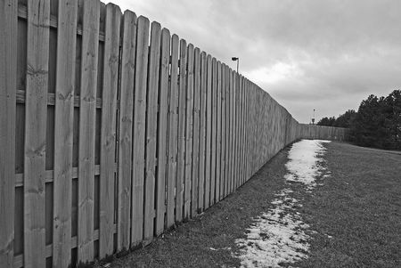 wooden fence in winterの写真素材