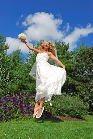 jumping bride with flipflopsの写真素材