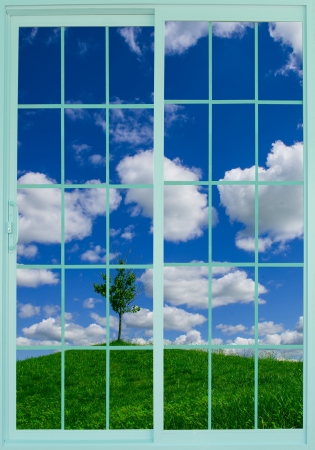 beautiful meadow through the windowの写真素材