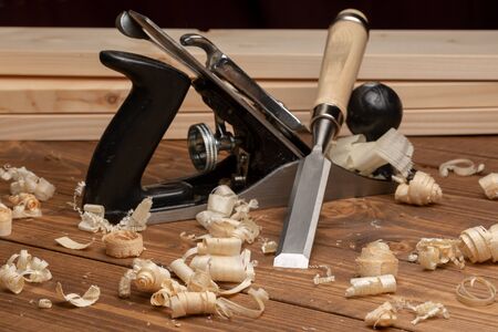 Chisel and metal planer with wood shavings