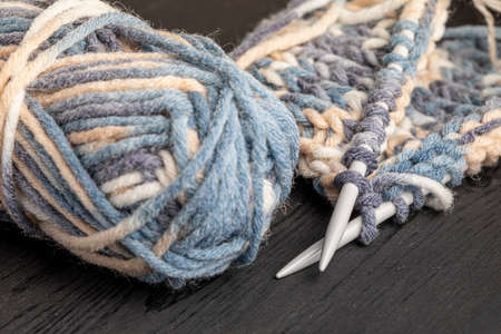 Photo of colored balls from knitting yarn. Knitting supplies close-up. Knitting-women's needlework.