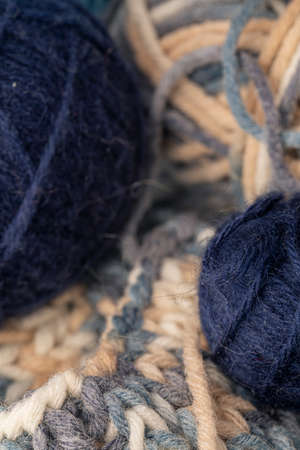 Photo of colored balls from knitting yarn. Knitting supplies close-up. Knitting-women's needlework.
