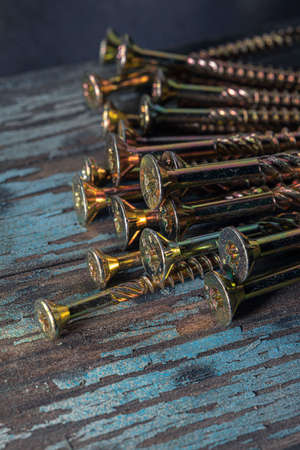 Structural self-tapping screws for Torx 25 bit. Construction abstraction. Industrial background.