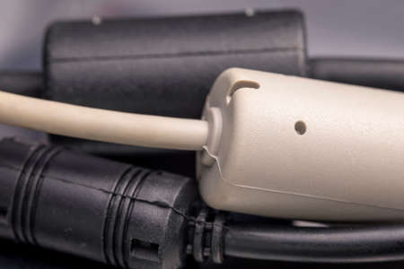 Close up of a ferrite bead inductor. An electrical element that suppresses high-frequency electronic...