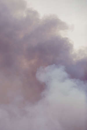 Swirling smoke from a large fire, similar to clouds. Cumulus clouds.の写真素材
