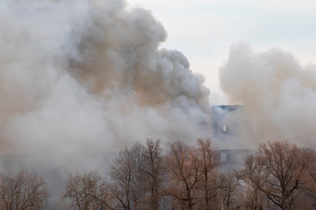 Smoke from a fire in a textile factory built in the late 19th century. Nevskaya Manufactura in St....