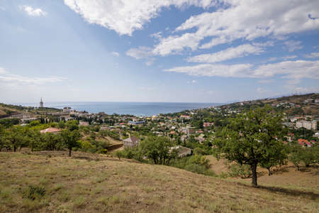 Malorechenskoye village, Crimea, August 15, 2021: View of the Malorechenskoye village and the Black Sea from the hill.のeditorial素材