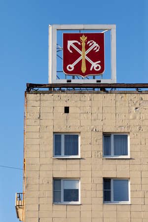 Coat of arms of St. Petersburg on the roof of the building. Soviet-built building.の写真素材