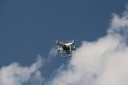 A drone flying over a meadowの写真素材