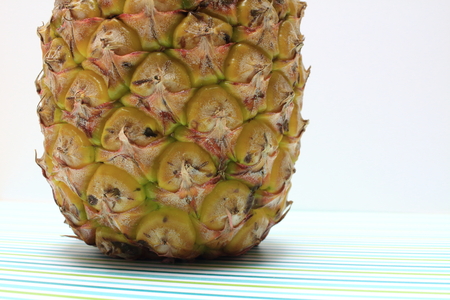 Ripe pineapple isolated on whiteの写真素材