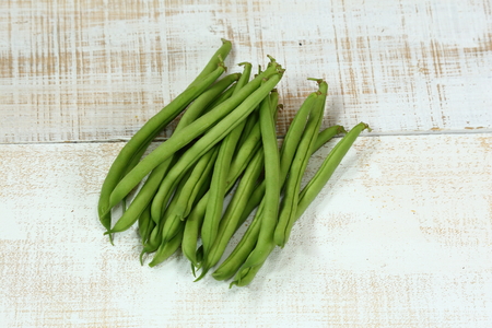 Green beans on white board.の写真素材