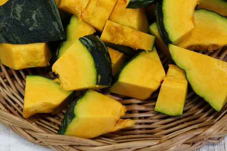 Fresh diced Pumpkin in bamboo basket.の写真素材