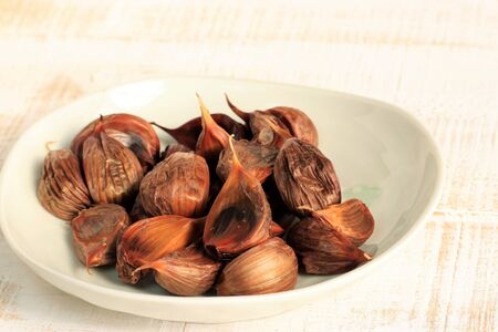 Traditional food black garlicの写真素材