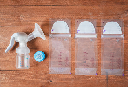 manual breast pump and milk bags. Copy space. Flatlay.の写真素材