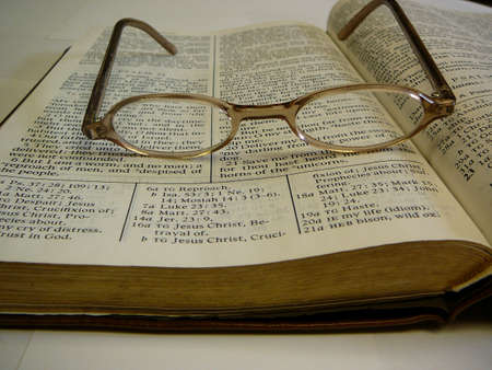 Study Bible with Eyeglasses on top.の写真素材