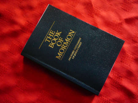 Book Of Mormon on red background