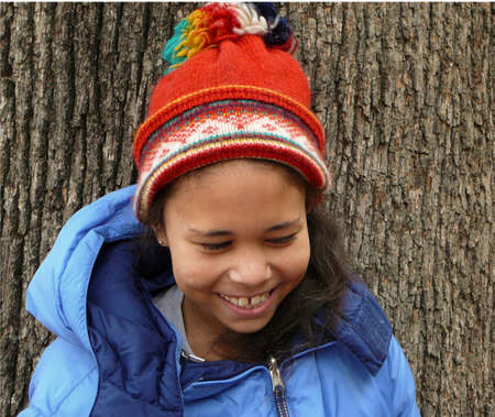 Child wearing hat and coat.の写真素材