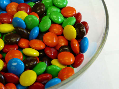 Bowl of Candy Coated Cocolatesの写真素材