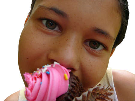 Child eating cupcakeの写真素材