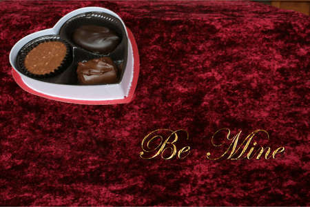 Valentine candy on red background with textの写真素材