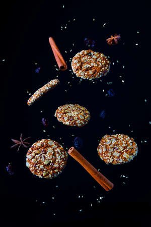 composition of falling cookies and cinnamonの写真素材
