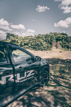 Putrajaya, Malaysia - February 17, 2019: New car perodua aruz exterior design at a green field on a sunny day focus on right side of the carのeditorial素材