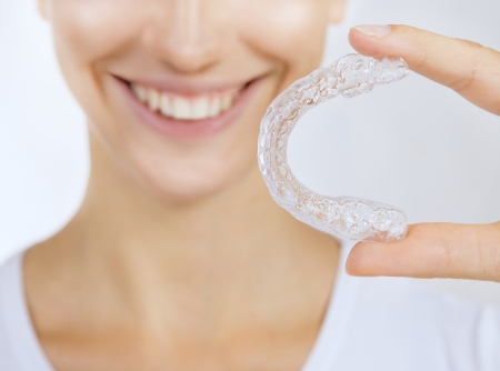 smiling girl with tooth tray - Beautiful smiling girl with tooth tray (hands holding individual...