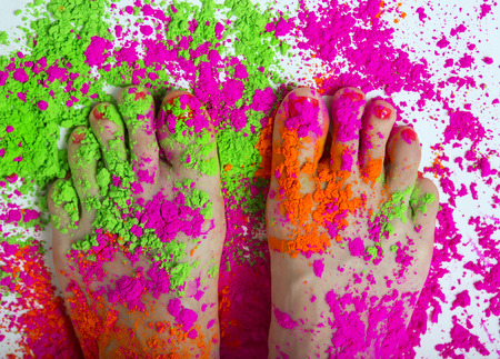 Happy Holi Festival! Holi Celebration Party - female feet colored Dry Bright Multicolor Paint Powder. Indian traditional spring color Festivalの写真素材