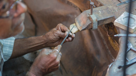 JAIPUR, Rajasthan, India â DEC, 2016: Indian Jeweler making an oriental Jewelry on Dec 2016, JAIPUR, India. Jaipur - center of Traditional Handicrafts and handmade Jewelry of Indiaのeditorial素材