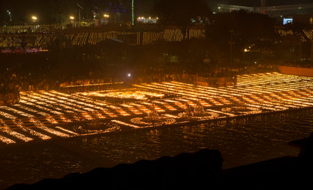 AYODYA, INDIA â Oct 2019: People celebrate Diwali Hindu Festival of Lights near the sacred river in Ayodya, India on Oct, 2019. Diwali (Deepavali) in Ayodhya celebrated with a military paradeのeditorial素材