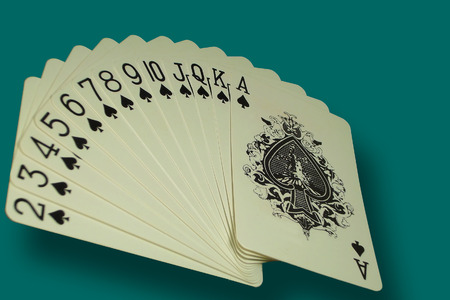 Playing cards over olive greenのeditorial素材