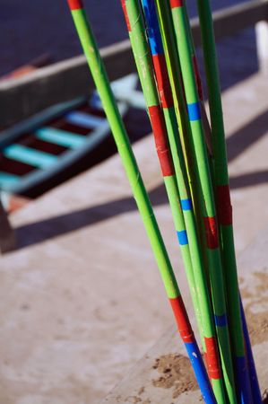 Colorful fishing poles with boat